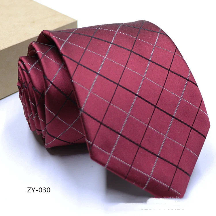 Maroon men's necktie with black and white checkered pattern, displayed next to a beige box