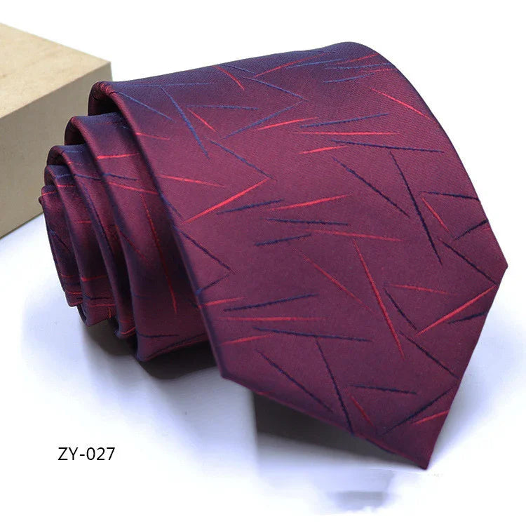 Rolled purple men's tie with red and navy diagonal stitch pattern on white background
