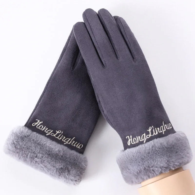 Pair of dark gray winter gloves with soft faux fur cuffs and embroidered brand name on white background