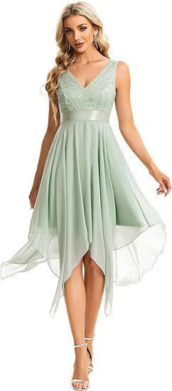 Elegant woman wearing a light green sleeveless dress with lace bodice and flowing asymmetrical hem