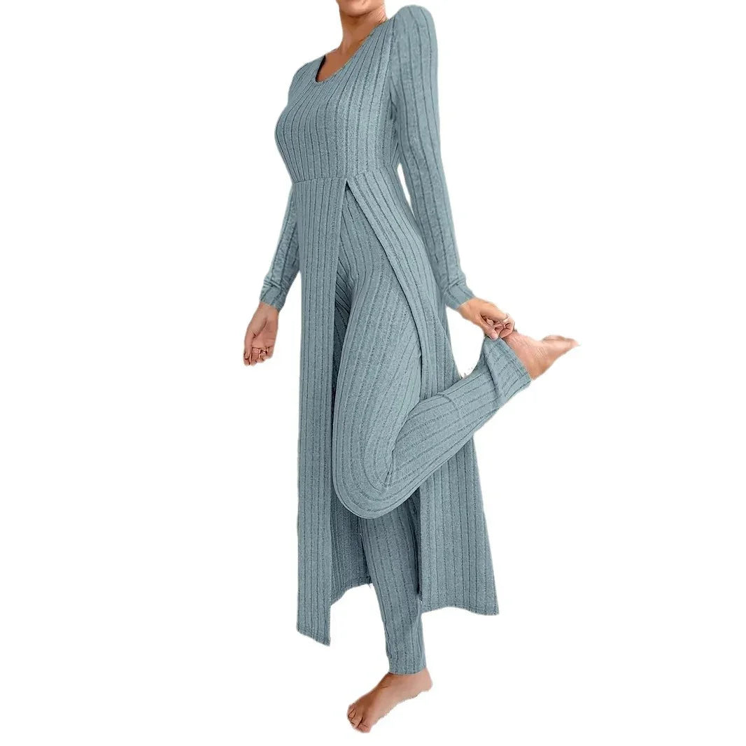 Woman wearing ribbed knit two-piece lounge set with long cardigan and matching pants in light gray