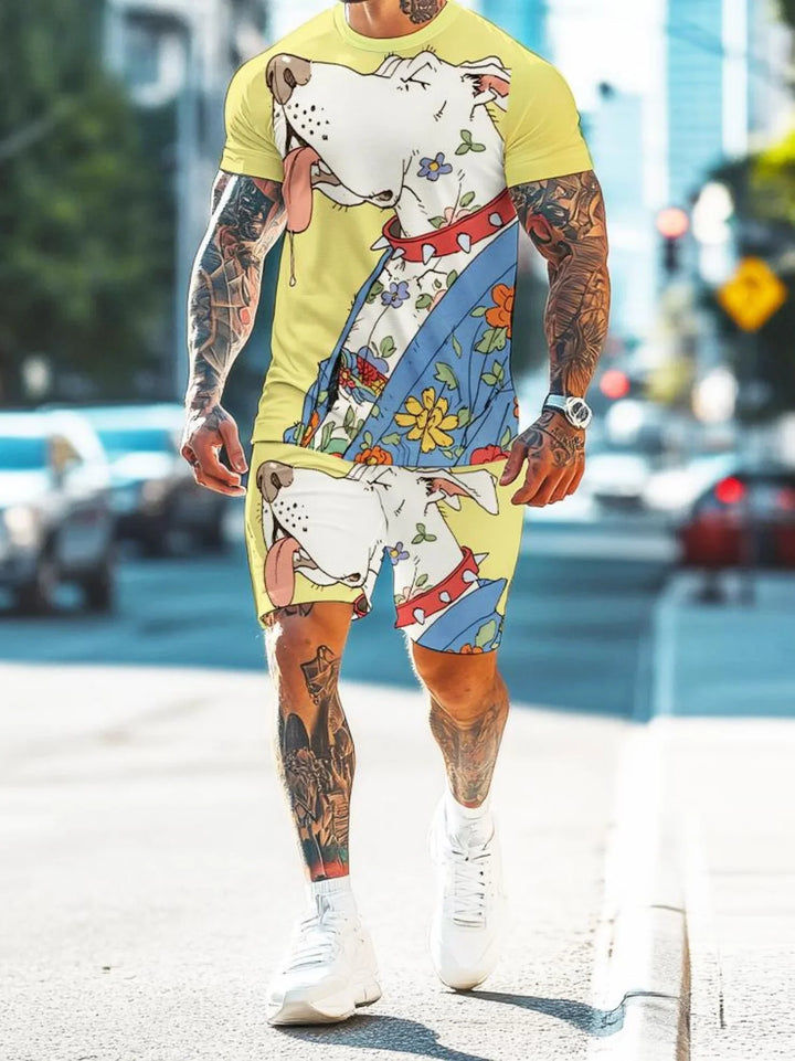 Man wearing tattooed arms and legs, yellow t-shirt and shorts with large floral dog illustration, white sneakers