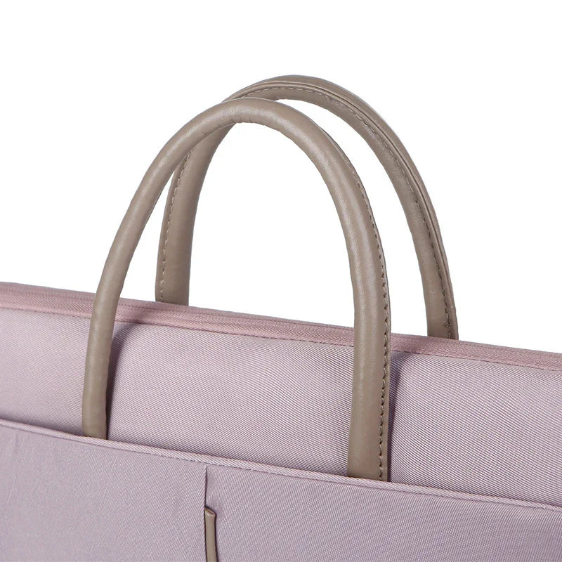 Close-up of beige leather handles on a light purple fabric handbag