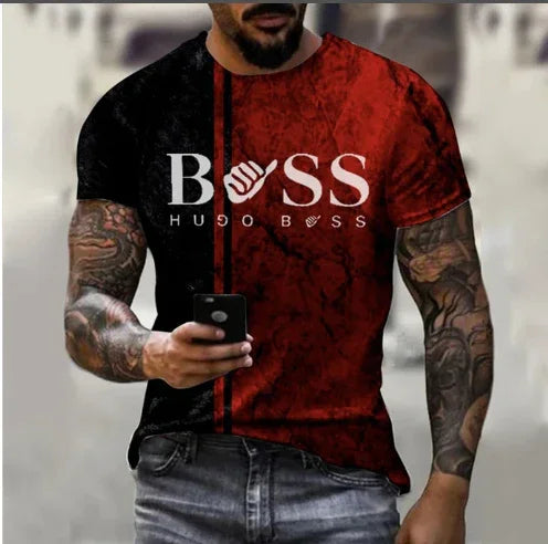 Man wearing black and red Hugo Boss T-shirt with tattoos on arms holding smartphone