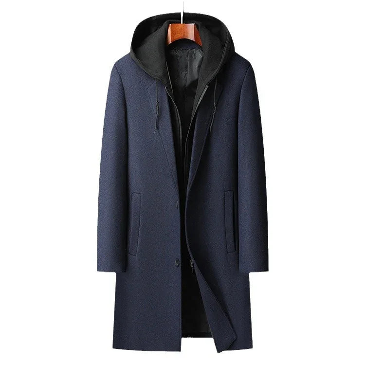 Men's navy blue wool coat with black hooded inner layer, front pockets, and button closure