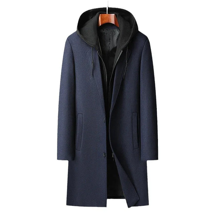 Men's navy blue wool coat with black hooded inner layer, front pockets, and button closure