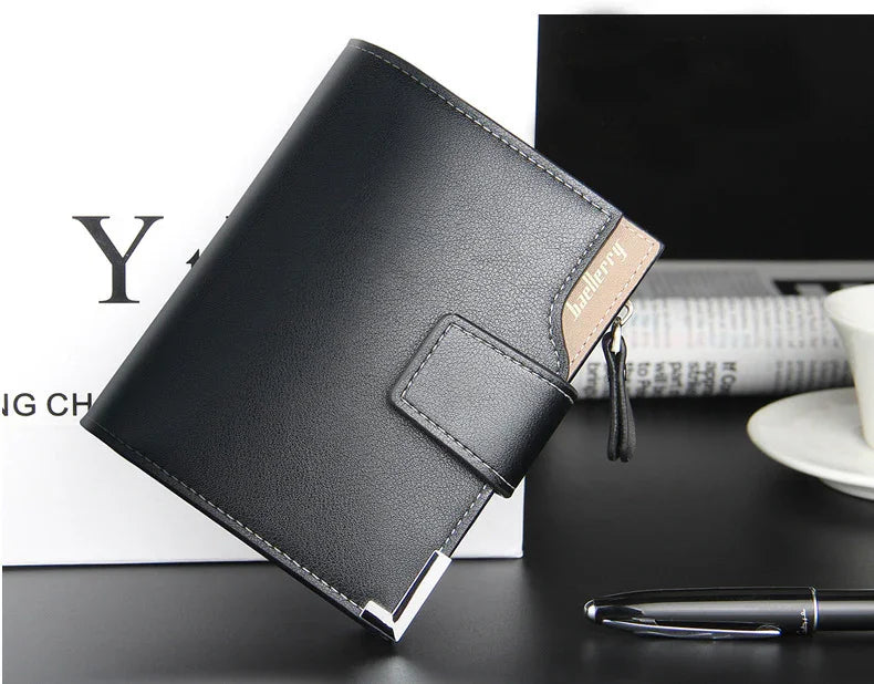 sleek black Baellerry leather wallet with secure snap closure and metal corner detail on desk