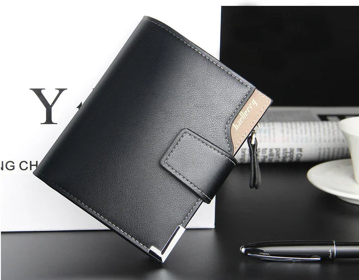 sleek black Baellerry leather wallet with secure snap closure and metal corner detail on desk