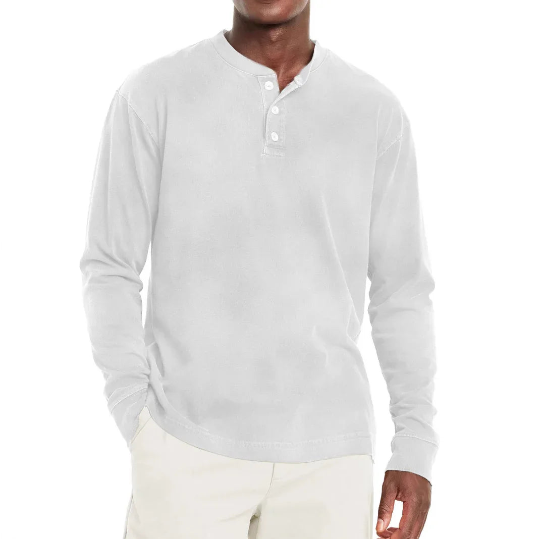 man wearing casual white long-sleeve henley shirt with button placket and light beige pants