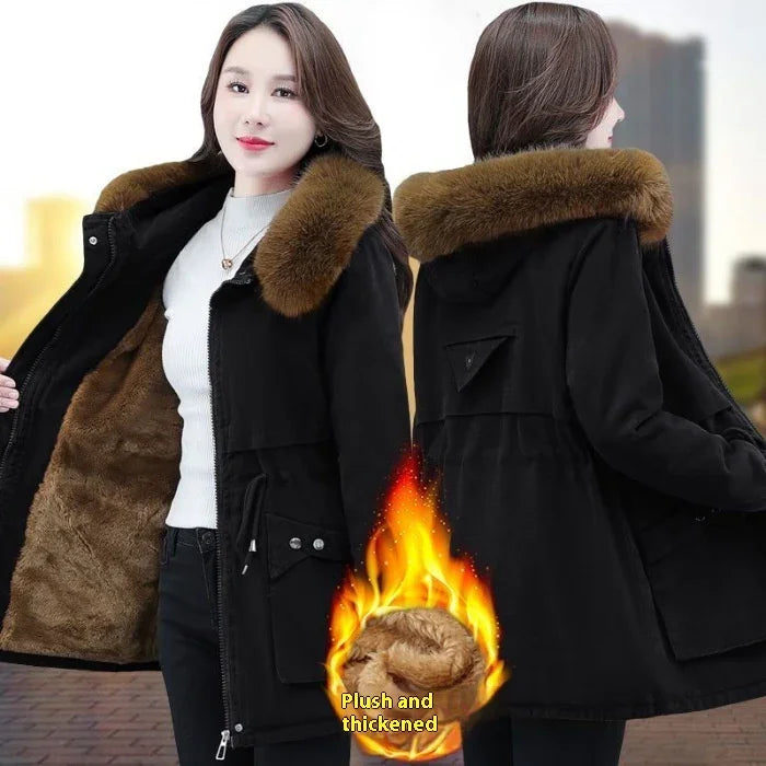 Woman wearing black winter coat with brown faux fur collar and plush thickened lining showing warmth