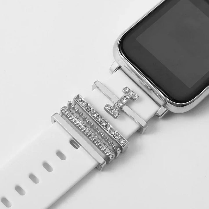 Close-up of white smartwatch strap with silver and rhinestone decorative charms