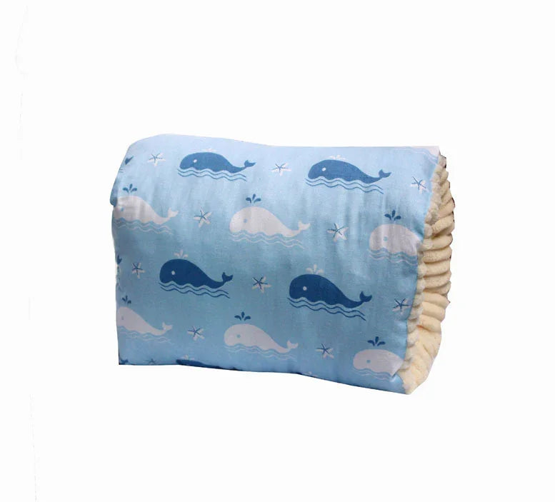 Blue baby pillow with white and dark blue whale and starfish print, soft plush sides