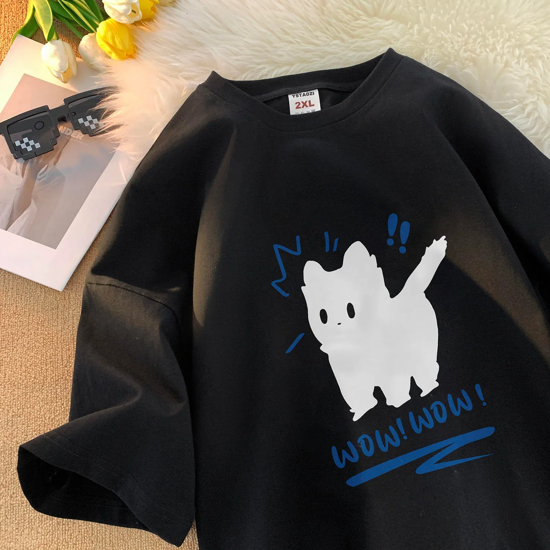 Black 2XL T-shirt with cute white cat graphic and blue text 'WOW! WOW!' on a fuzzy white surface