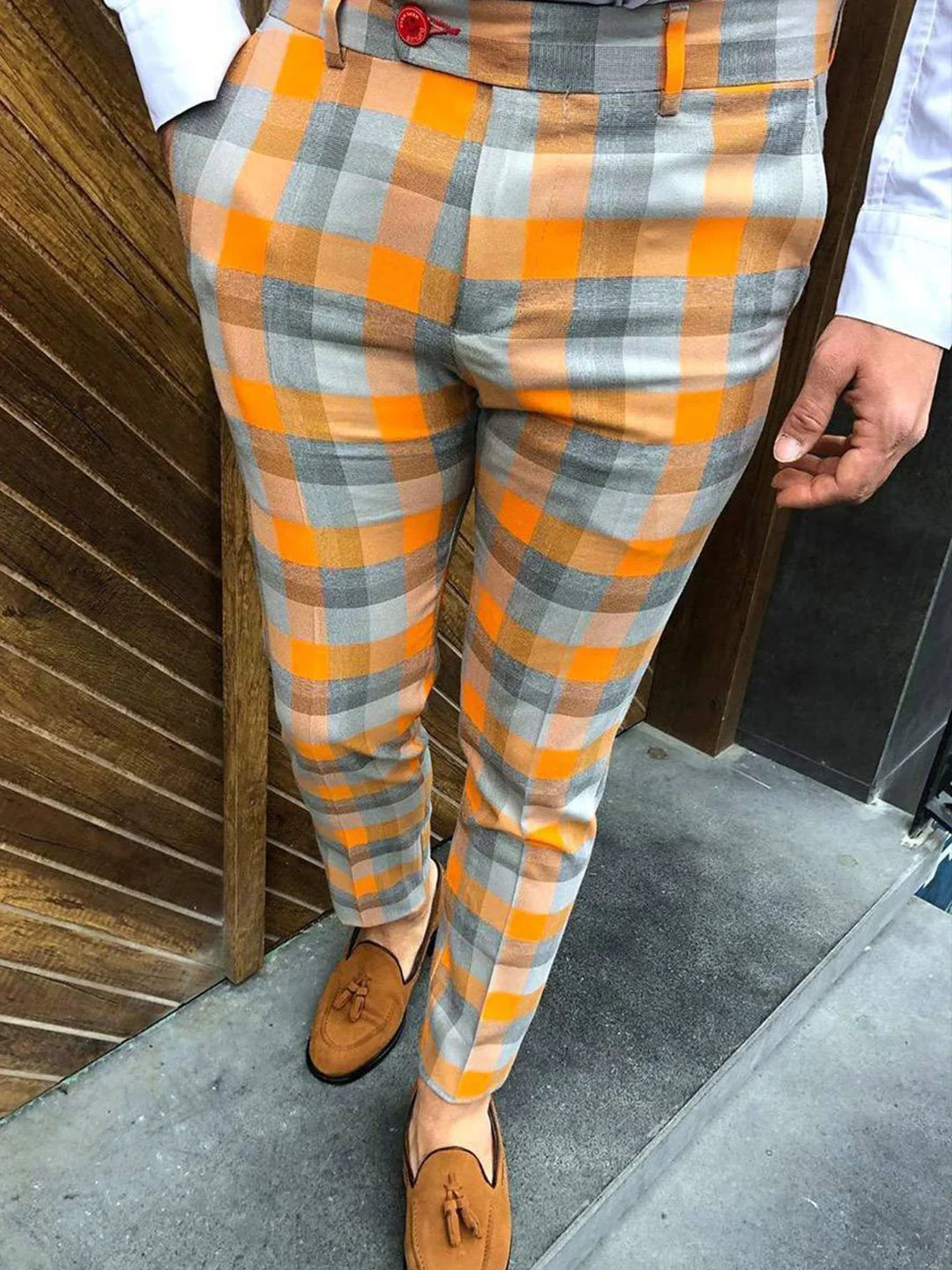 Men's slim-fit plaid trousers in orange, gray, and beige with brown tassel loafers