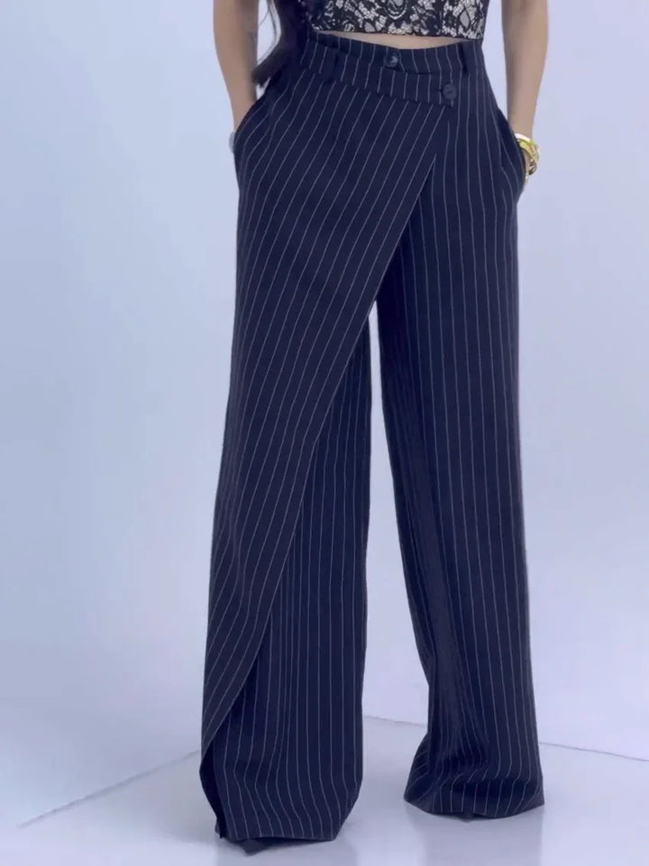 Women's high-waisted navy blue pinstripe wide-leg pants with wrap front and pockets