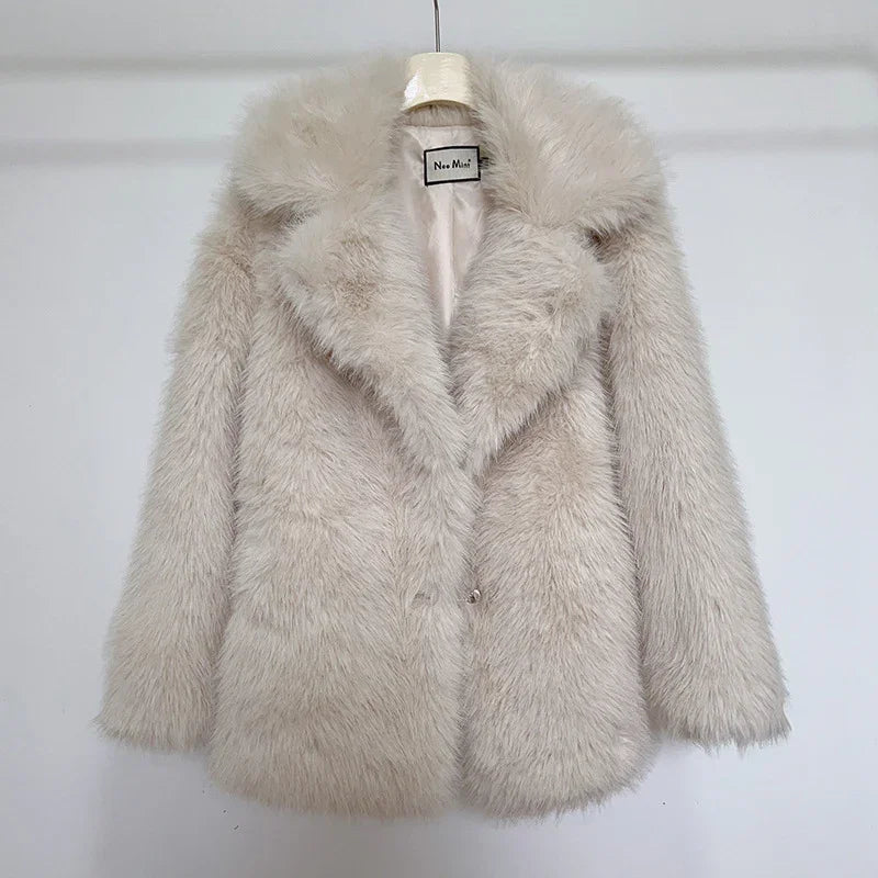 Light beige faux fur coat with wide collar on hanger against white background