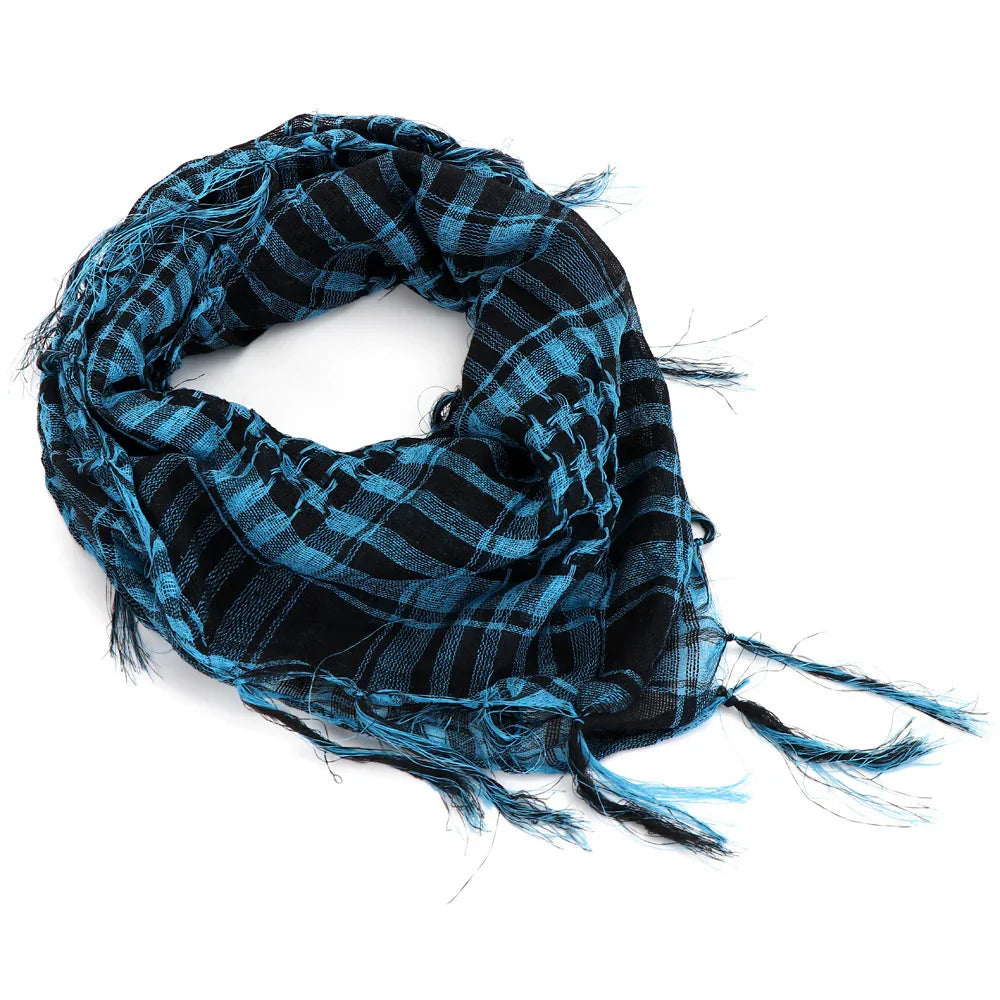 Blue and black checkered scarf with fringed edges on white background