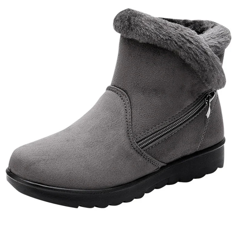Gray suede ankle winter boot with fur collar and side zipper on black sole