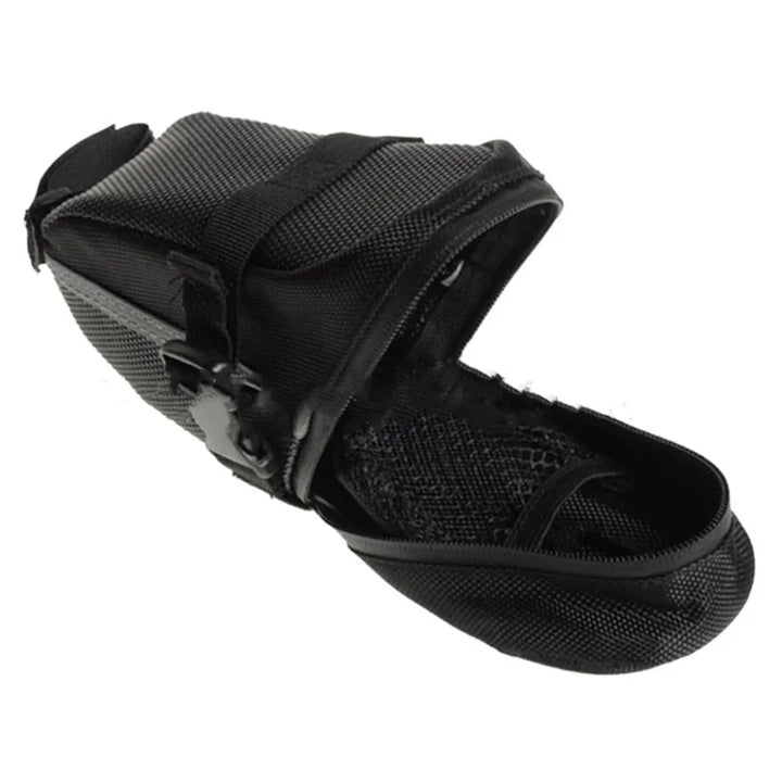 Black mesh and nylon dog muzzle with adjustable straps on white background