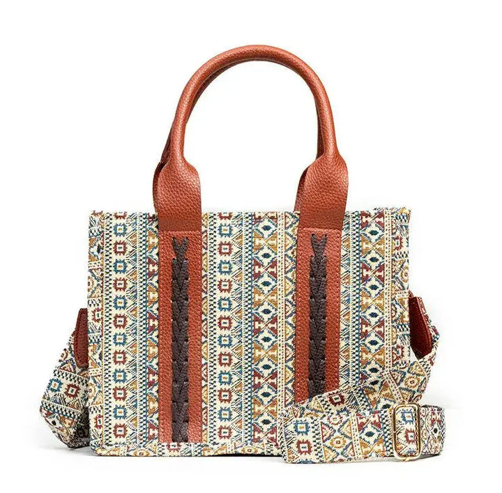 Bohemian style tote bag with multicolor geometric pattern and brown leather handles and accents