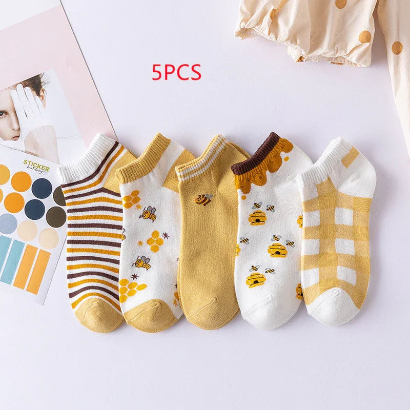 Set of 5 yellow and white ankle socks with bee, honeycomb, stripe, and check patterns