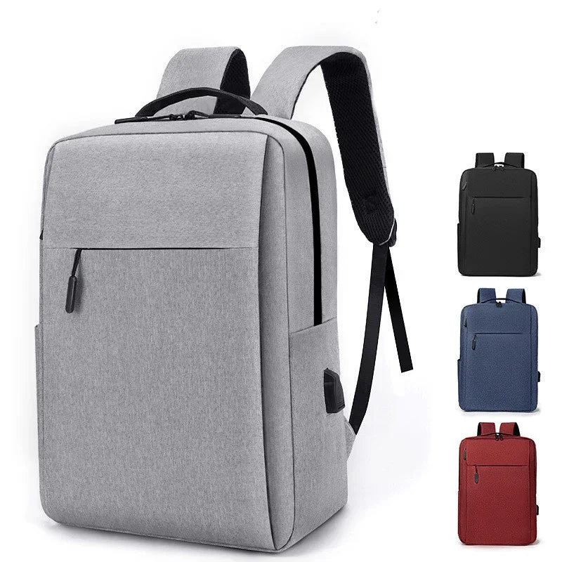 Modern grey backpack with black zipper, USB port, and padded straps shown with black, blue, and red variants