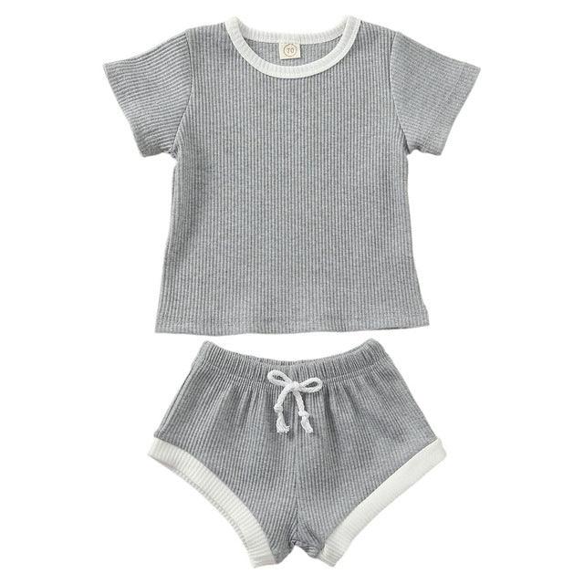 Grey ribbed short sleeve top and matching shorts with white trim and drawstring, casual loungewear set