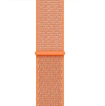 Close-up of orange woven nylon smartwatch band with loop and textured pattern
