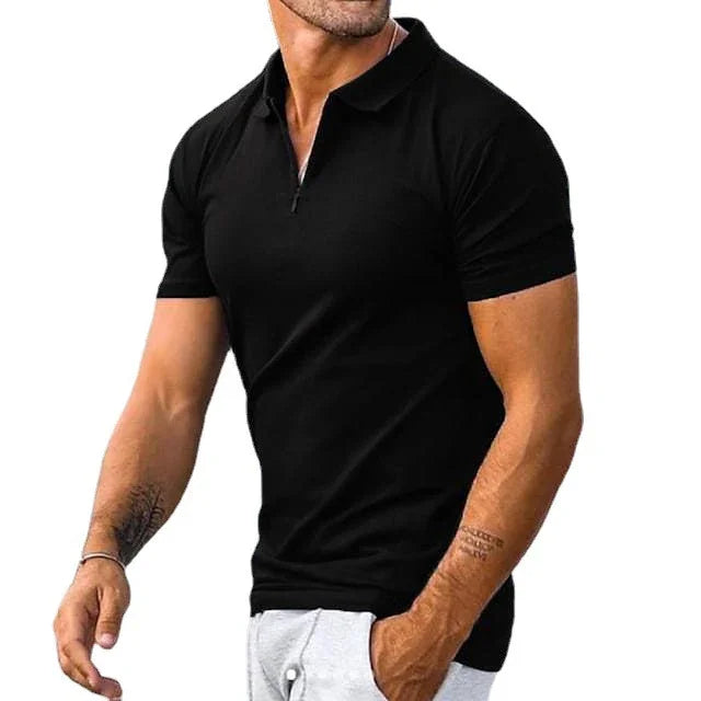 man wearing fitted black short-sleeve polo shirt with zipper and light gray pants