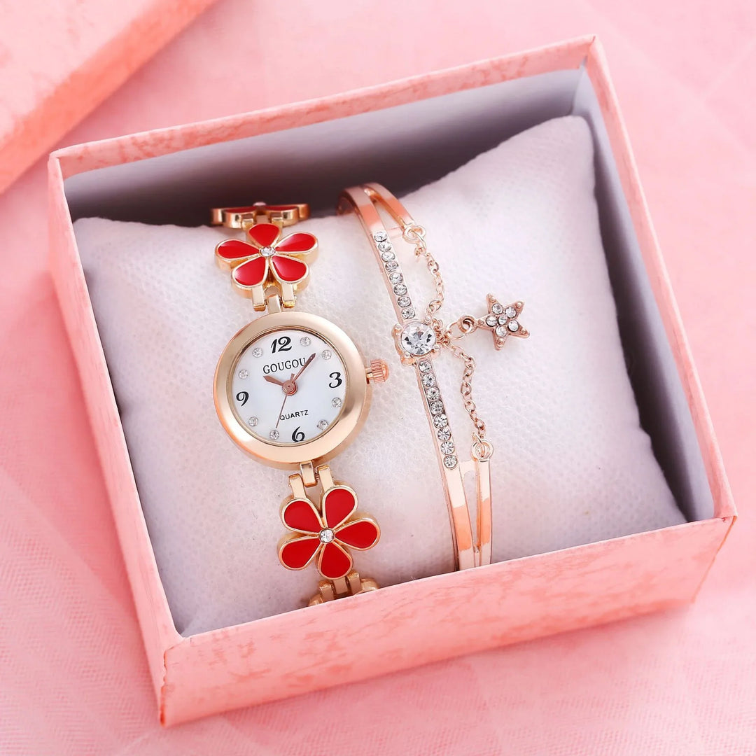 Rose gold women's watch with red flower accents and rhinestone bracelet in pink gift box