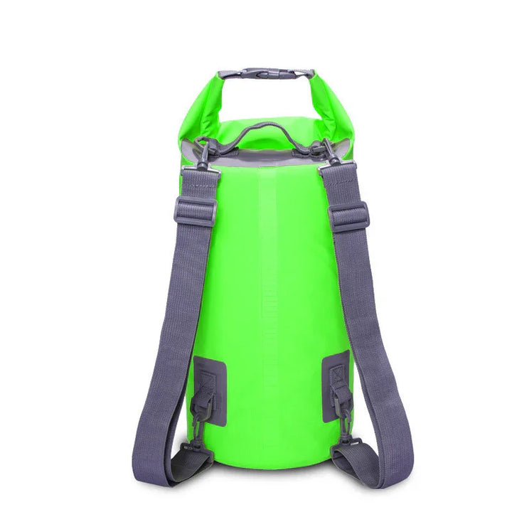 Neon green waterproof dry bag backpack with adjustable gray straps on white background