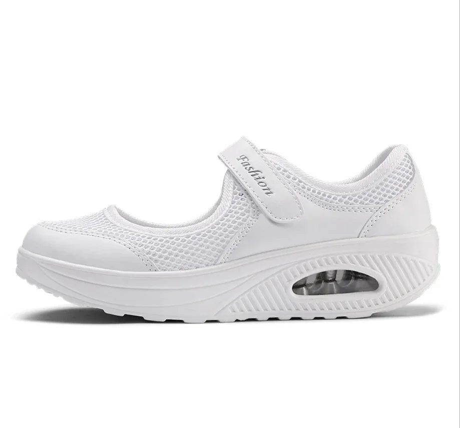 White breathable mesh Mary Jane sneaker with thick sole and adjustable strap labeled fashion