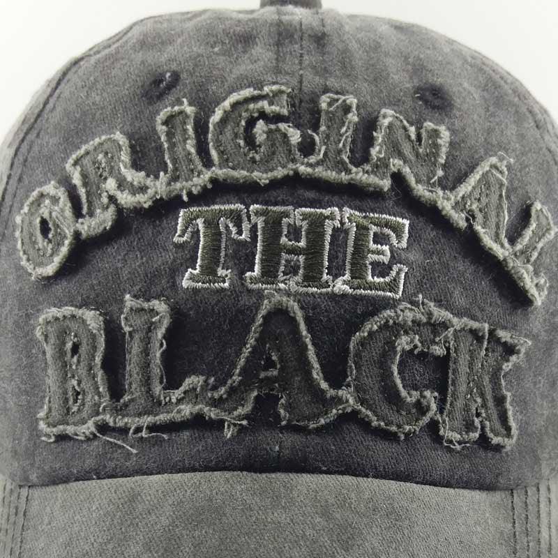 Worn black baseball cap with distressed embroidered text 'ORIGINAL THE BLACK' on front