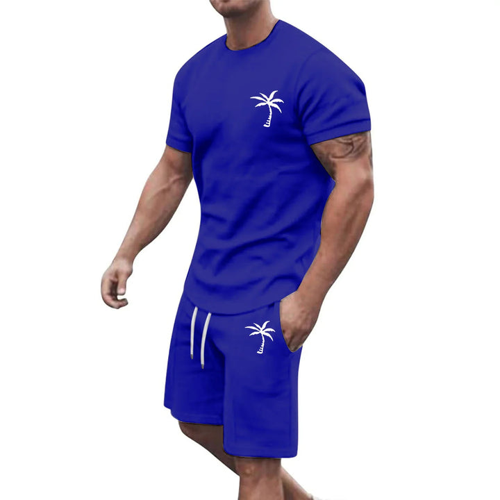 Man wearing royal blue casual cotton T-shirt and shorts set with white palm tree logo