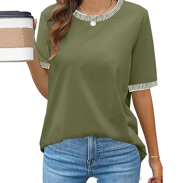Woman wearing olive green casual t-shirt with white striped collar and sleeve trim, holding coffee cup
