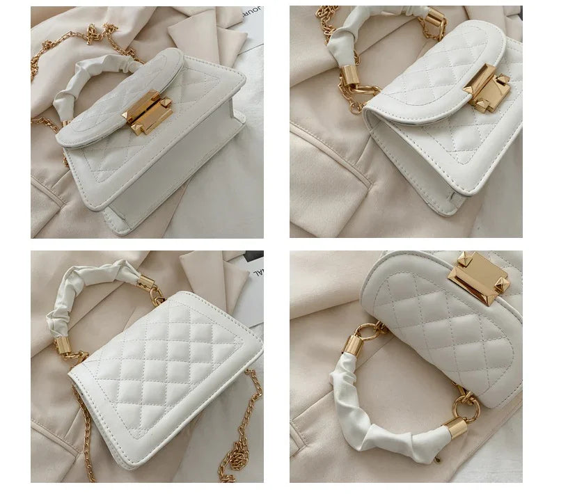 Elegant white quilted leather handbag with gold hardware and chain strap on beige fabric