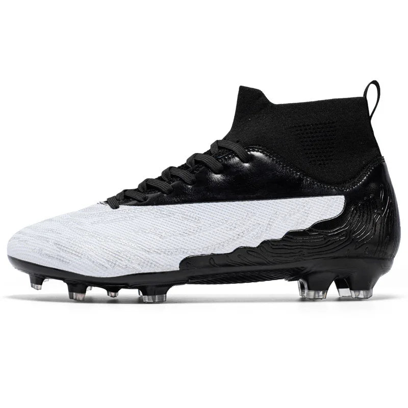 Black and white soccer cleat with high ankle knit collar and studded sole for firm ground