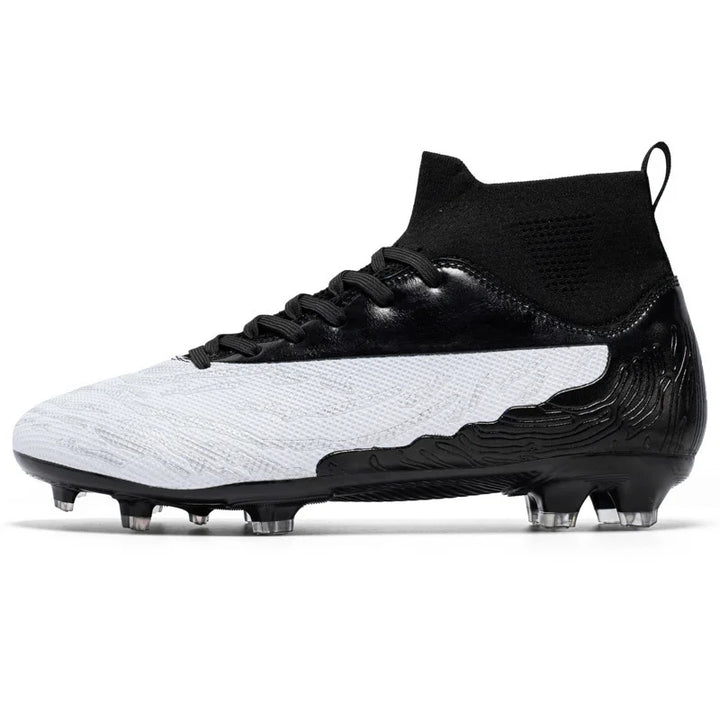 Black and white soccer cleat with high ankle knit collar and studded sole for firm ground