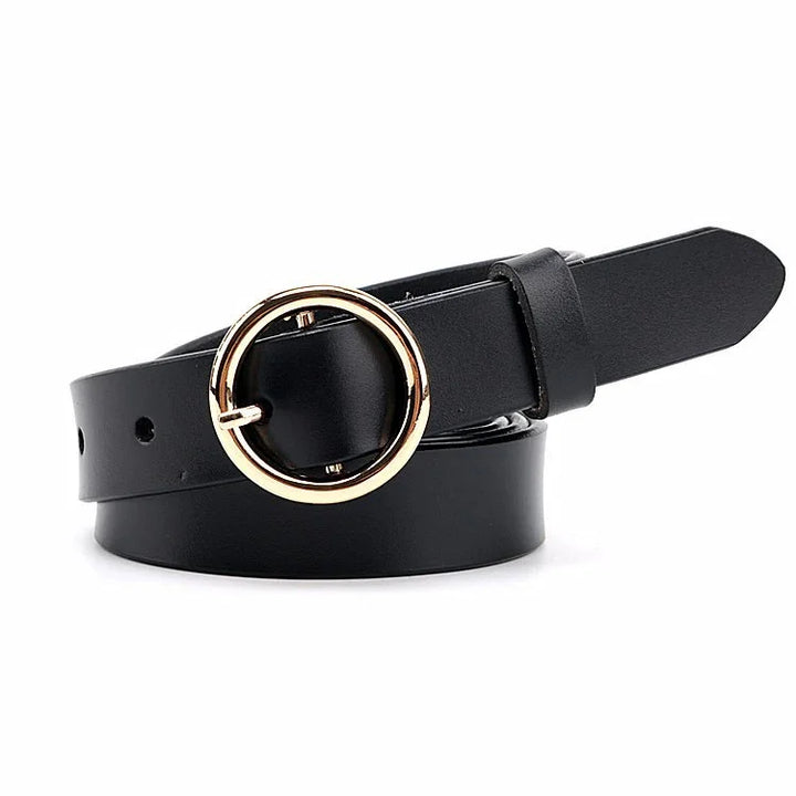 Black leather belt with a round gold metal buckle, rolled up on white background