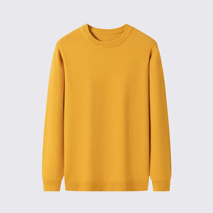 Mustard yellow crewneck sweater with long sleeves and ribbed cuffs and hem