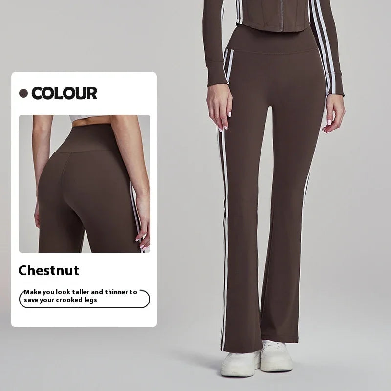 Woman wearing chestnut brown flared pants with white side stripes and matching top