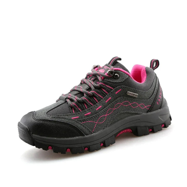 Black and pink women's hiking shoe with rugged sole and mesh fabric details