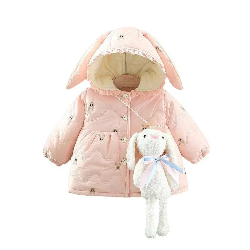 Pink baby jacket with bunny ears hood and small embroidered bunnies, holding a plush bunny bag