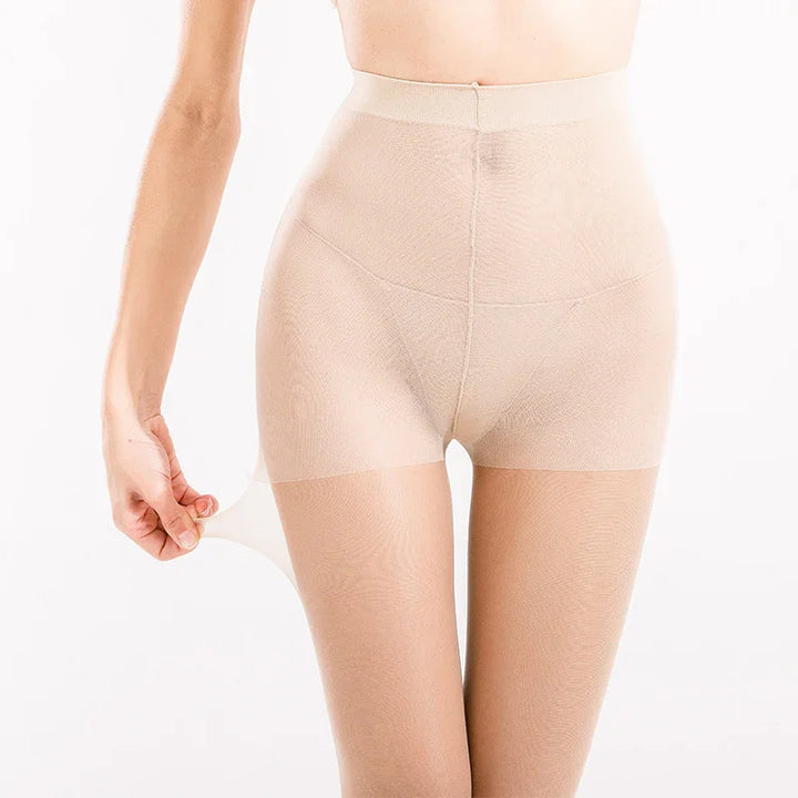 Close-up of woman wearing beige high-waisted sheer nylon pantyhose, demonstrating stretch