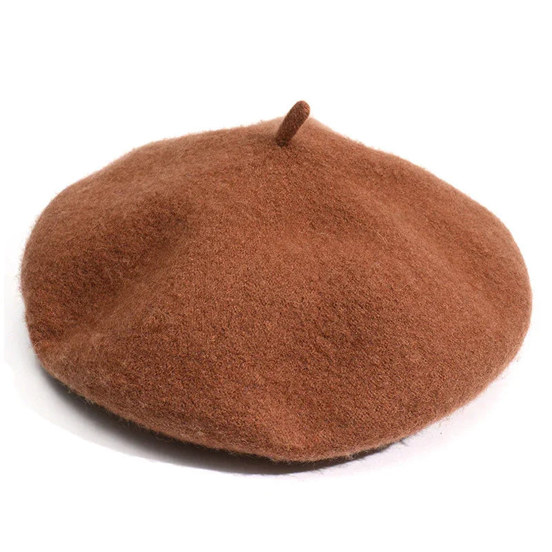 classic brown wool beret hat with top stem on white background