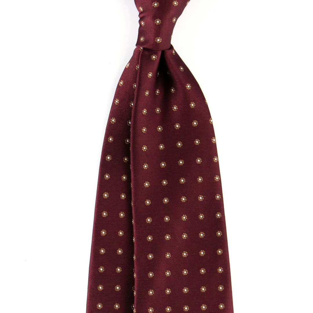 Burgundy silk necktie with small white and gold floral dot pattern