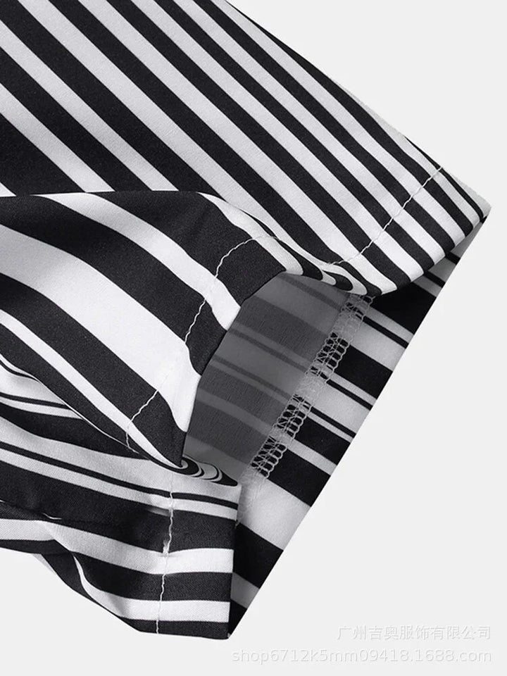 Close-up of black and white striped shirt cuff with detailed stitching on a light background