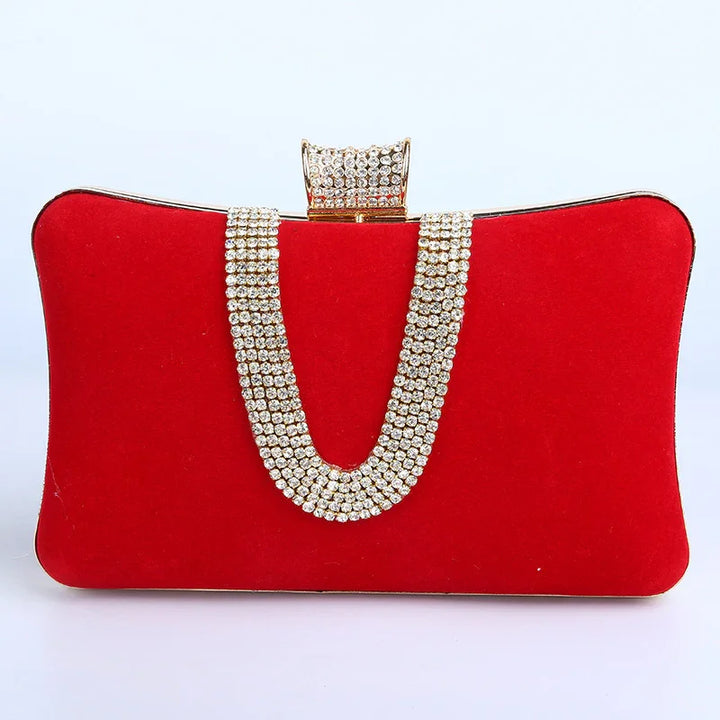 Red velvet evening clutch bag with rhinestone strap and jeweled clasp