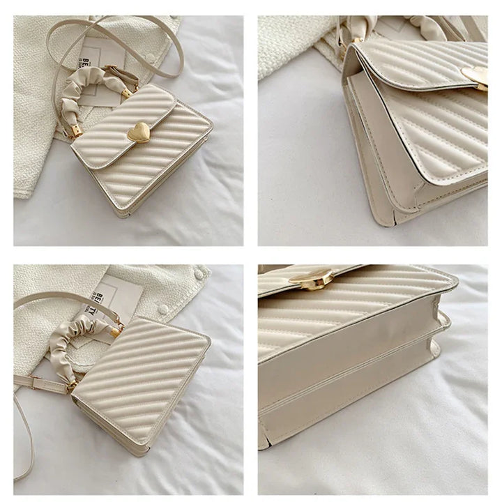 Cream beige quilted crossbody handbag with ruched handle and gold heart clasp detail