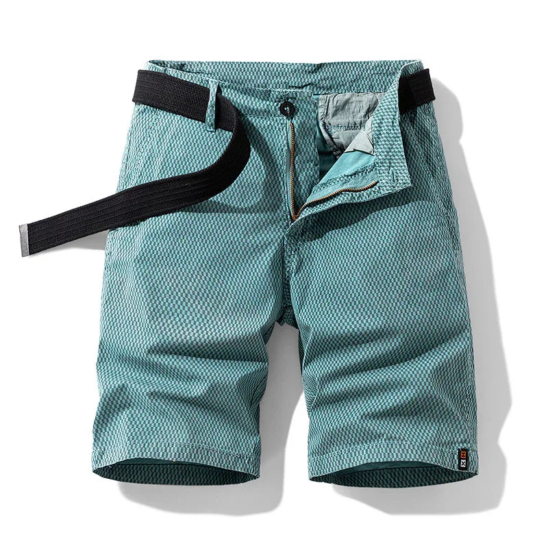 Men's teal textured casual shorts with black belt, zip and button closure on white background